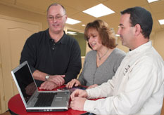 a couple and salesman using Basement Vision software
