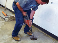 Coring the concrete of a concrete slab floor in Kahnawake