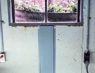 Repaired waterproofed basement window leak in Longueuil